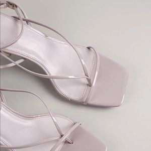 LOW toe-post patent leather strapped stilettos